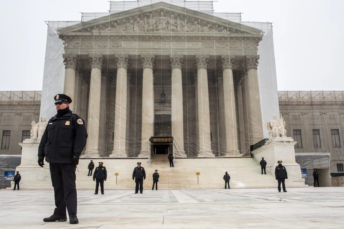 Police officers guard the plaza in front of the U.S. Supreme Court as anti-abortion protesters hold the March for Life in Washington, D.C., on on Jan. 25, 2013. The pro-life gathering is held each year around the anniversary of the Roe v. Wade Supreme Court decision. (Brendan Hoffman/Getty Images)
