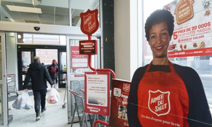 An automated donation stand for the Salvation Army is seen on the way out of a grocery store in Montreal, Dec. 21, 2020. (The Canadian Press/Paul Chiasson)