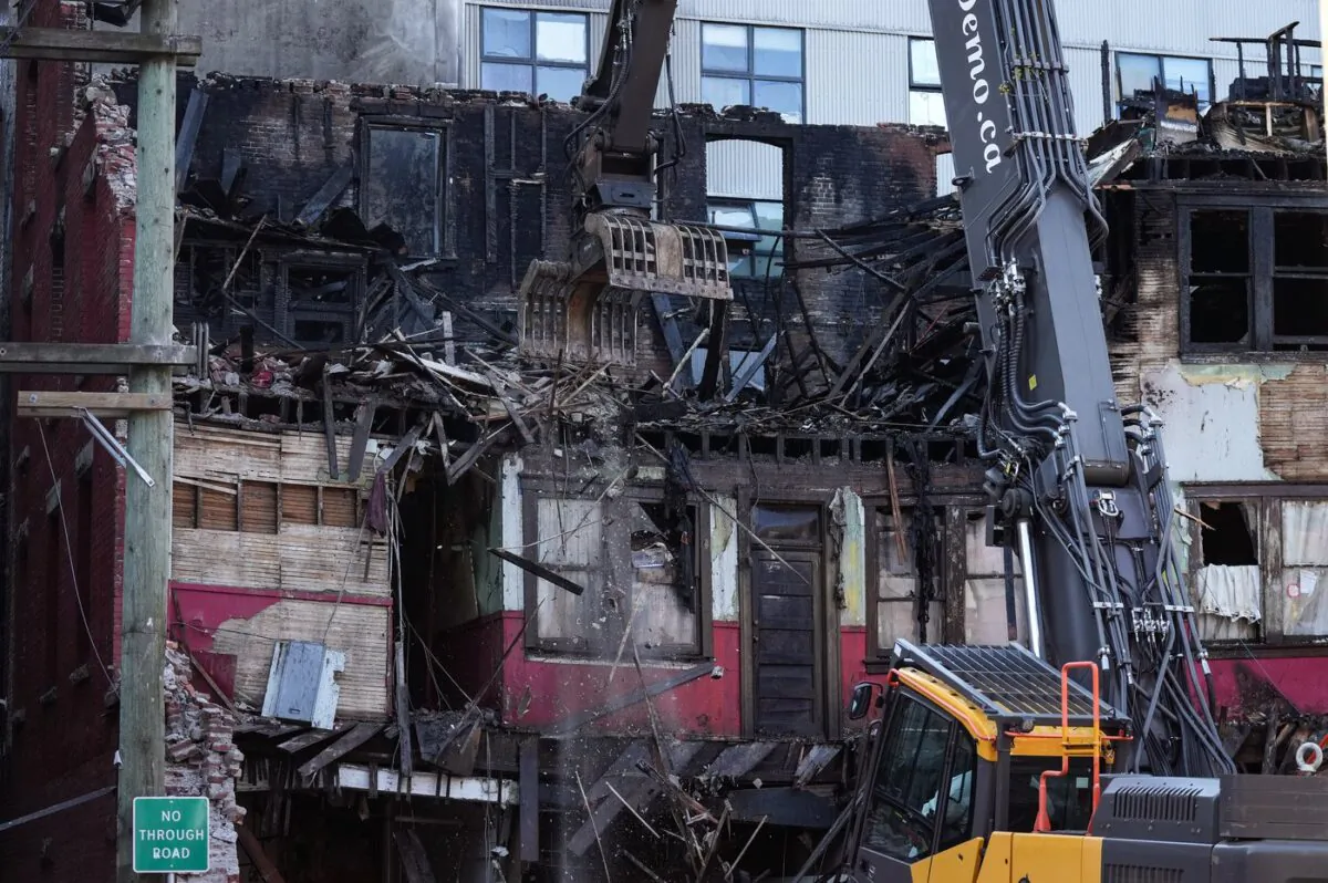 Demolition on the Winters Hotel has been paused after a second body was found in the building, in Vancouver, B.C., April 22, 2022. (The Canadian Press/Darryl Dyck)