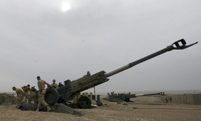 Soldiers with the Royal Canadian Horse Artillery B Troop move their M777 155mm Howitzer at the forward operating base in Helmand Province, Afghanistan April 15, 2007. (The Canadian Press/Ryan Remiorz)