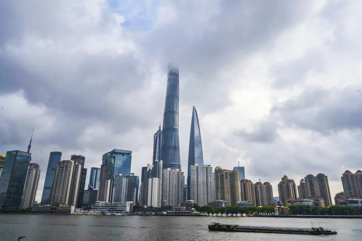 A boat travels on the Huangpu River as the skyline of the city is seen, including the Shanghai Tower, in Shanghai, China, on Aug. 28, 2020. (Kevin Frayer/Getty Images)
