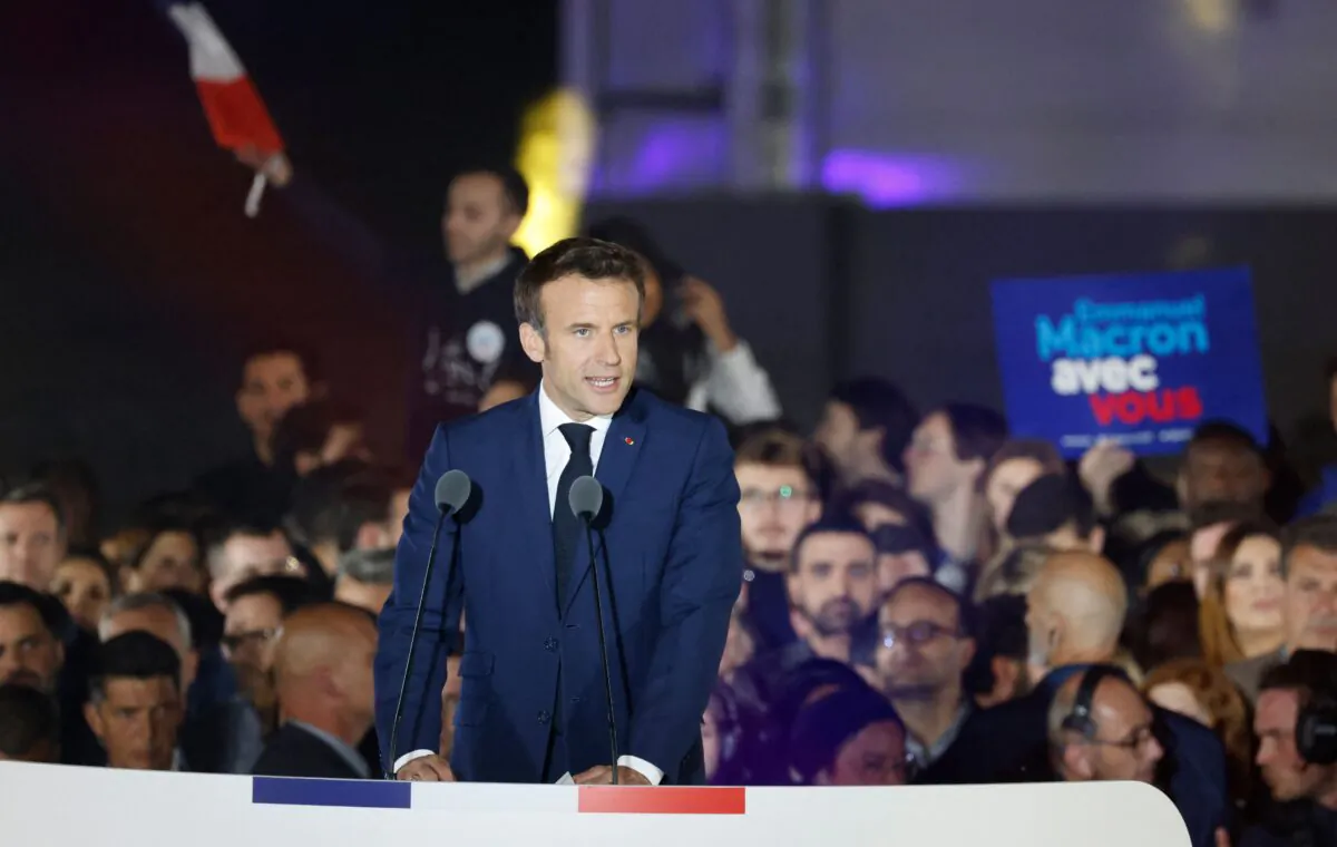 French President and La Republique en Marche (LREM) party candidate for reelection Emmanuel Macron celebrates after his victory in France's presidential election, at the Champ de Mars in Paris, on April 24, 2022. (Ludovic Marin/AFP via Getty Images)