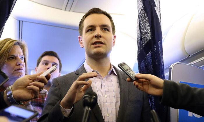 Robby Mook, campaign manager for Democratic presidential nominee and former Secretary of State Hillary Clinton, speaks aboard the campaign plane while traveling to Cedar Rapids, Iowa, on Oct. 28, 2016. (Justin Sullivan/Getty Images)