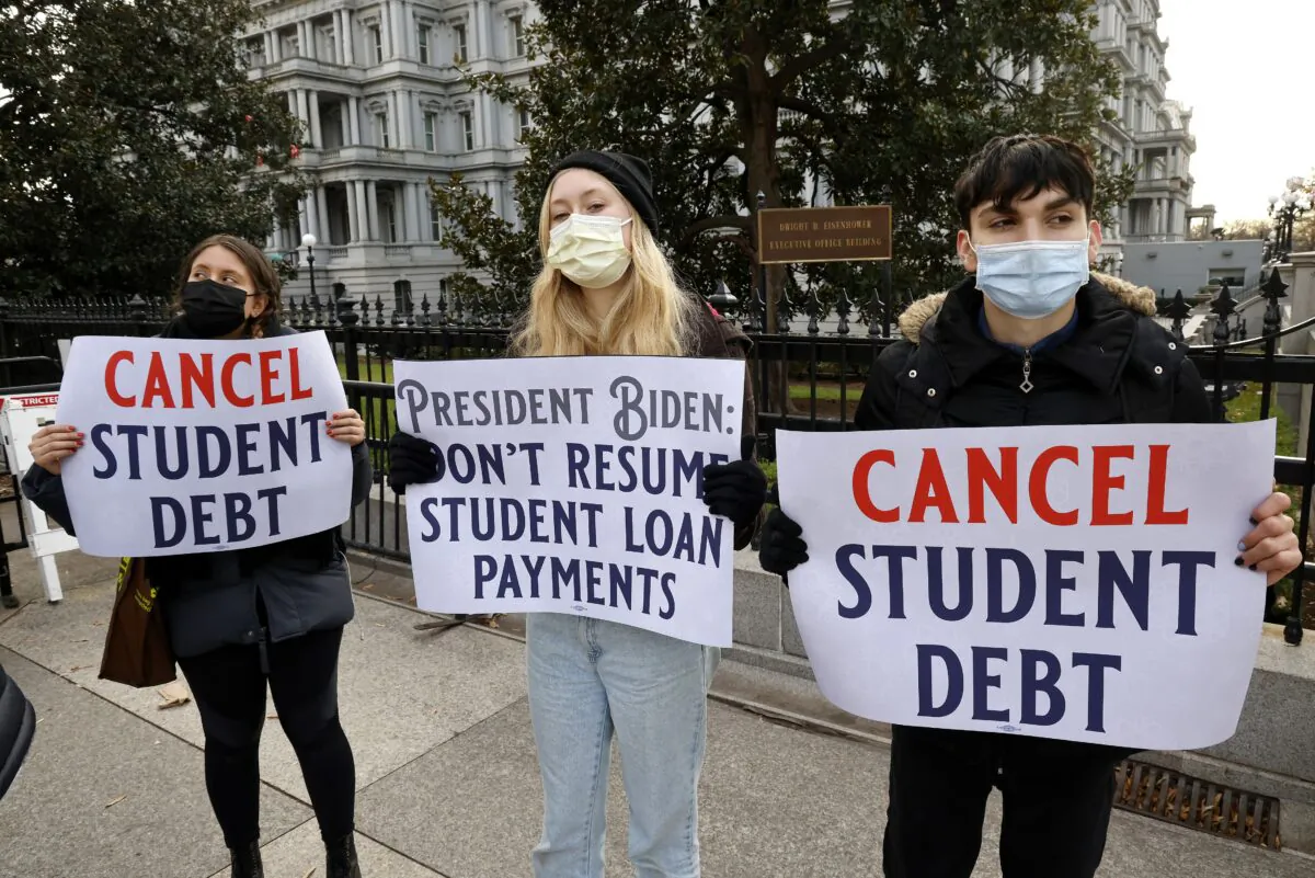 Activists call on President Joe Biden to not resume student loan payments in February and to cancel student debt, in Washington, on Dec. 15, 2021. (Paul Morigi/Getty Images for We, The 45 Million)