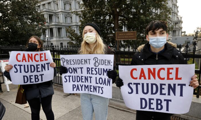 Activists call on President Biden to not resume student loan payments in February and to cancel student debt near The White House on December 15, 2021 in Washington, DC. (Photo by Paul Morigi/Getty Images for We, The 45 Million)