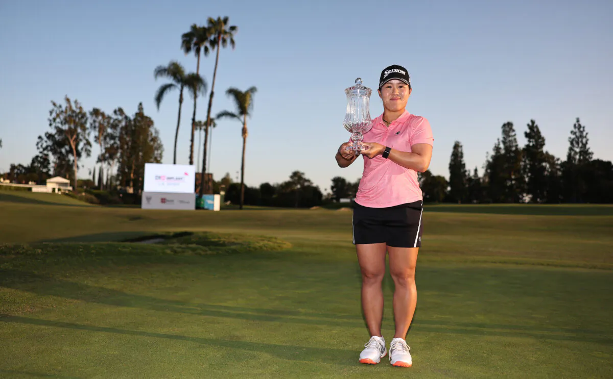 Nasa Hataoka of Japan poses for the media with DIO Implant LA Open Trophy after winning in the final round of the DIO Implant LA Open at Wilshire Country Club, in Los Angeles, Calif., on April 24, 2022. (Michael Owens/Getty Images)