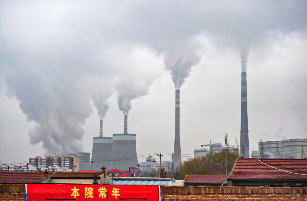 Smoke belches from a coal-fueled power station near Datong, China on Nov. 19, 2015. (Greg Baker/AFP via Getty Images)  