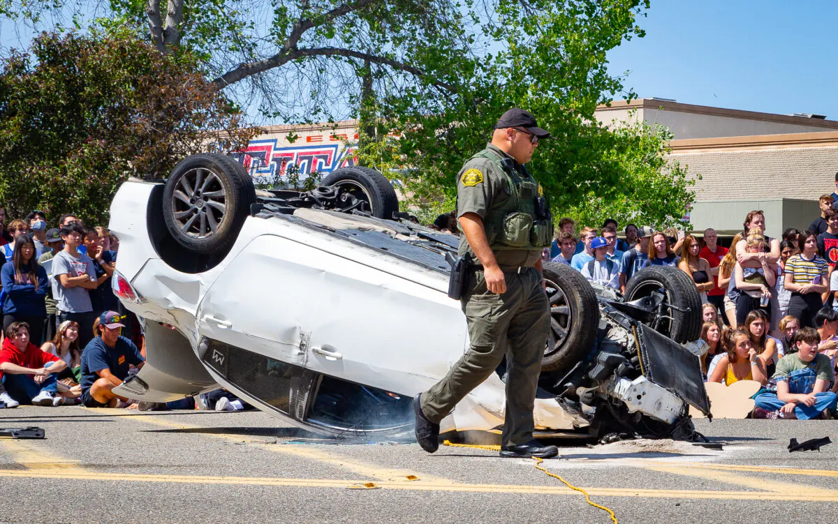 Students at Tesoro High School watch a mock DUI crash in Las Flores, Calif., on April 25, 2022. (John Fredricks/The Epoch Times)