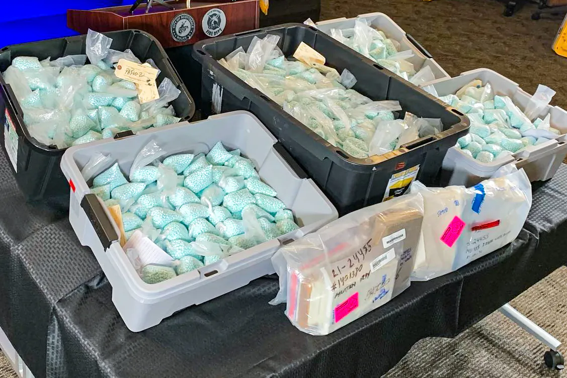 Illicit fentanyl-laced pills and other narcotics are displayed by law enforcement during a press conference in Scottsdale, Ariz., on Dec. 16, 2021. (Scottsdale PD)