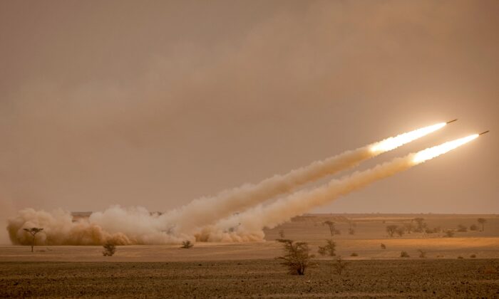 A U.S. M142 High Mobility Artillery Rocket System (HIMARS) launchers fire salvoes during the "African Lion" military exercise in the Grier Labouihi region in southeastern Morocco on June 9, 2021. (Fadel Senna/AFP via Getty Images)