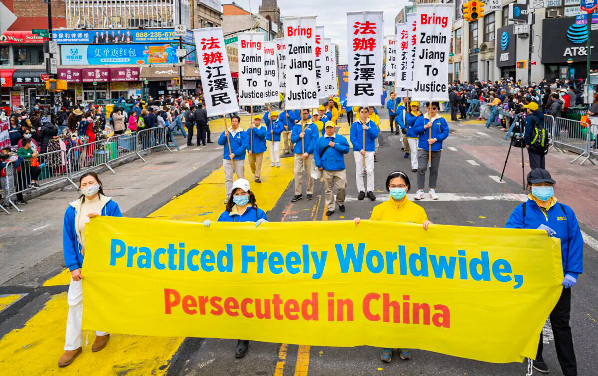 Falun Gong practitioners participate in a parade to commemorate the 23rd anniversary of the April 25th peaceful appeal of 10,000 Falun Gong practitioners in Beijing, in Flushing, N.Y., on April 23, 2022. (Larry Dye/The Epoch Times)