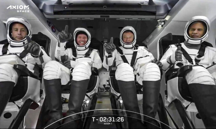 From left are Canadian private equity CEO Mark Pathy, American real estate tycoon Larry Connor; Michael Lopez-Alegria, an Axiom vice president who flew to space four times while a NASA astronaut, and Israeli investor Eytan Stibbe of Tel Aviv. The SpaceX crew seated in the Dragon spacecraft in Cape Canaveral, Fla., on April 8, 2022. (SpaceX via AP)