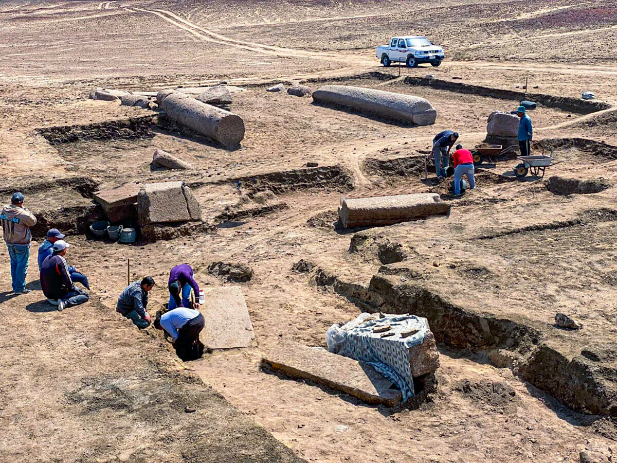 Archeologists working in the ruins of a temple for Zeus-Kasios, the ancient Greek god, at the Tell el-Farma archaeological site in the northwestern corner of the Sinai Peninsula on April 25, 2022. (Egyptian Tourism and Antiquities Ministry via AP)