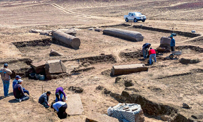 Archeologists working in the ruins of a temple for Zeus-Kasios, the ancient Greek god, at the Tell el-Farma archaeological site in the northwestern corner of the Sinai Peninsula on April 25, 2022. (Egyptian Tourism and Antiquities Ministry via AP)