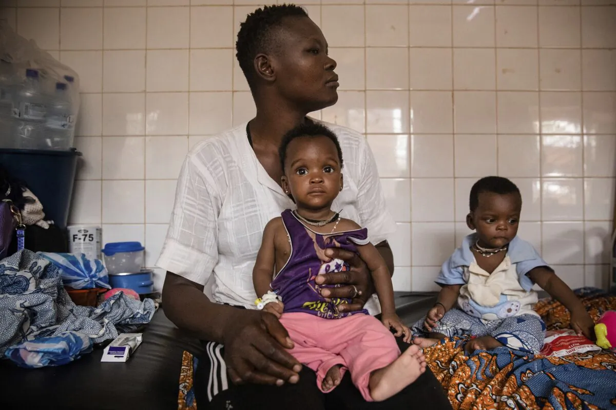 Malnourished children wait for treatment in the pediatric department of Boulmiougou hospital in Ouagadougou, Burkina Faso, on April 15, 2022. (Sophie Garcia/AP Photo)