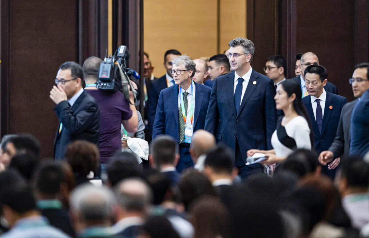 Microsoft founder Bill Gates (centre L) arrives to take part in a forum at the first China International Import Expo (CIIE) in Shanghai on Nov. 5, 2018. (Matthew Knight/AFP via Getty Images)