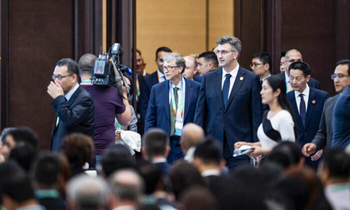Microsoft founder Bill Gates (centre L) arrives to take part in a forum at the first China International Import Expo (CIIE) in Shanghai on Nov. 5, 2018.  (Matthew Knight/AFP via Getty Images)