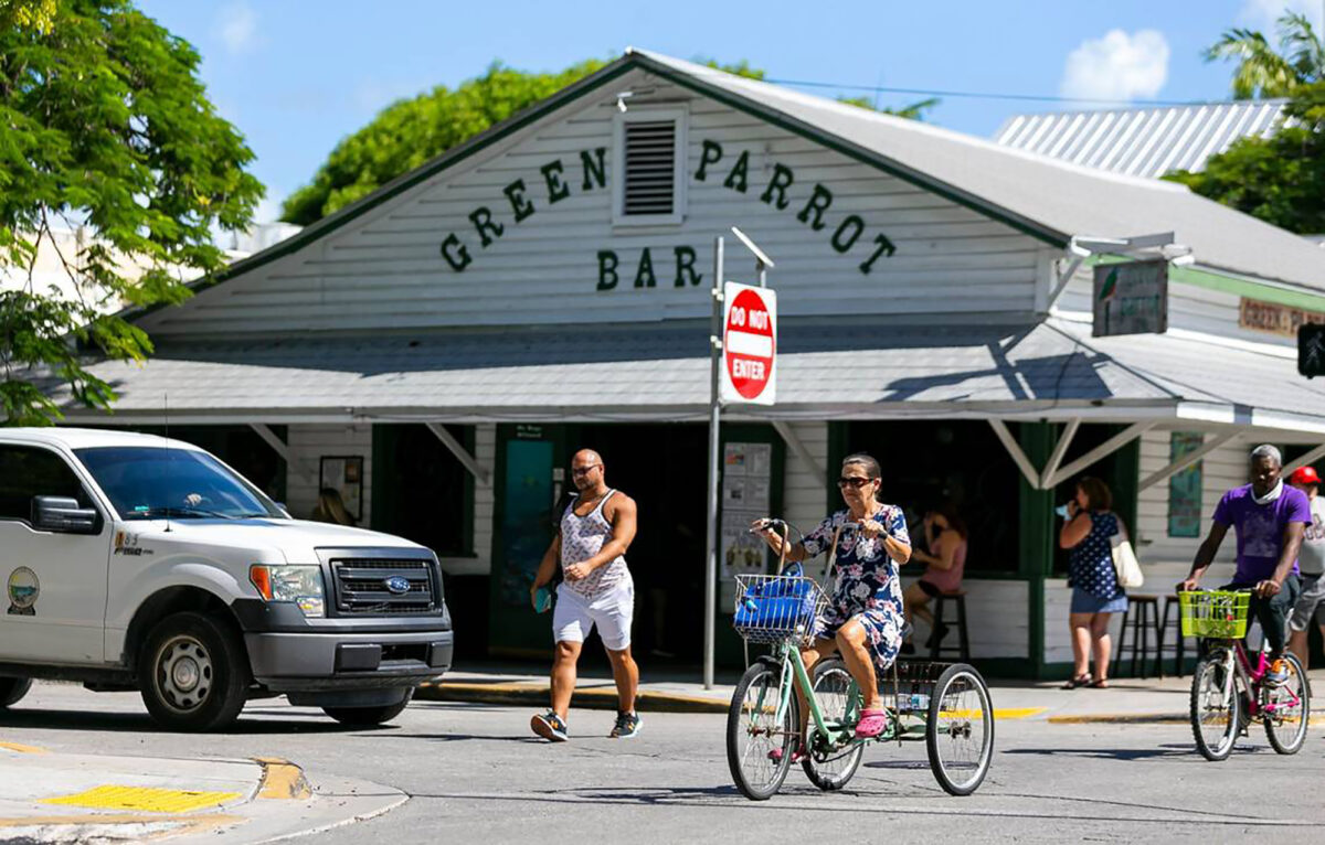 People make their way past Green Parrot Bar in Key West, Florida, on Oct. 12, 2021. (Matias J. Ocner/Miami Herald/TNS)