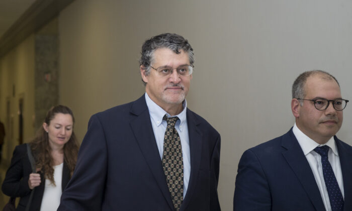 Fusion GPS co-founder Glenn Simpson (C) leaves with his attorney, Joshua Levy (R) after meeting with members of the House Judiciary and Oversight Committee in Washington on Oct. 16, 2018. (Zach Gibson/Getty Images)