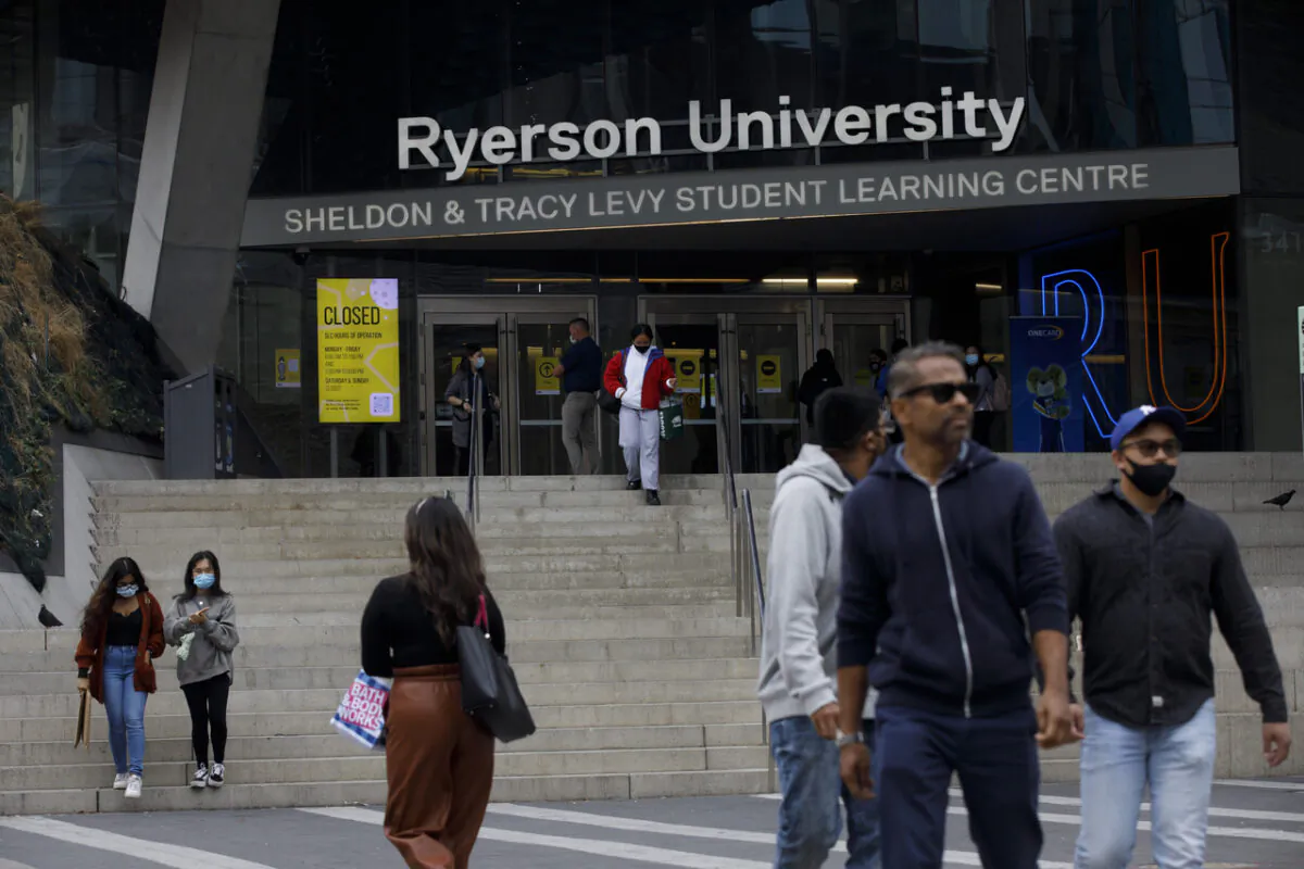People are seen on the front steps of Ryerson University on campus in Toronto, on Sept. 8, 2020. (Cole Burston/The Canadian Press)
