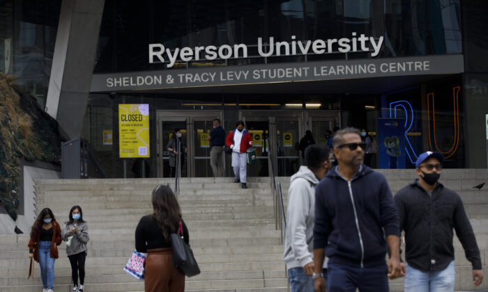 People are seen on the front steps of Ryerson University on campus in Toronto, on Sept. 8, 2020. (Cole Burston/The Canadian Press)
