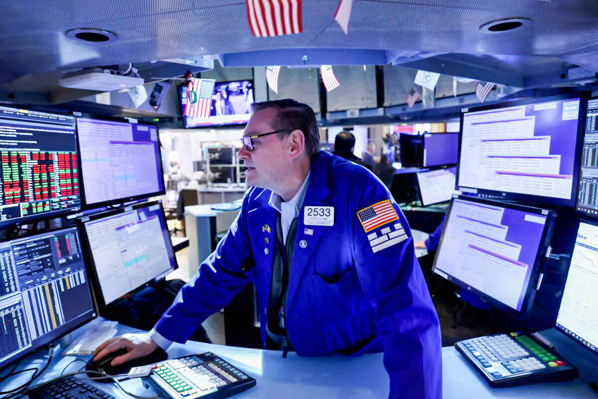 A trader works on the trading floor at the New York Stock Exchange (NYSE) in Manhattan, New York City, on April 11, 2022. (Andrew Kelly/Reuters)