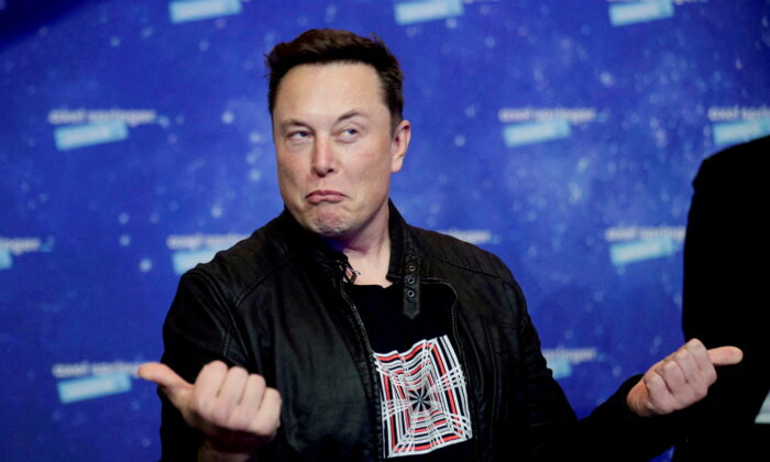 SpaceX owner and Tesla CEO Elon Musk grimaces after arriving on the red carpet for the Axel Springer award in Berlin, Germany, on Dec. 1, 2020. (Hannibal Hanschke/Reuters)