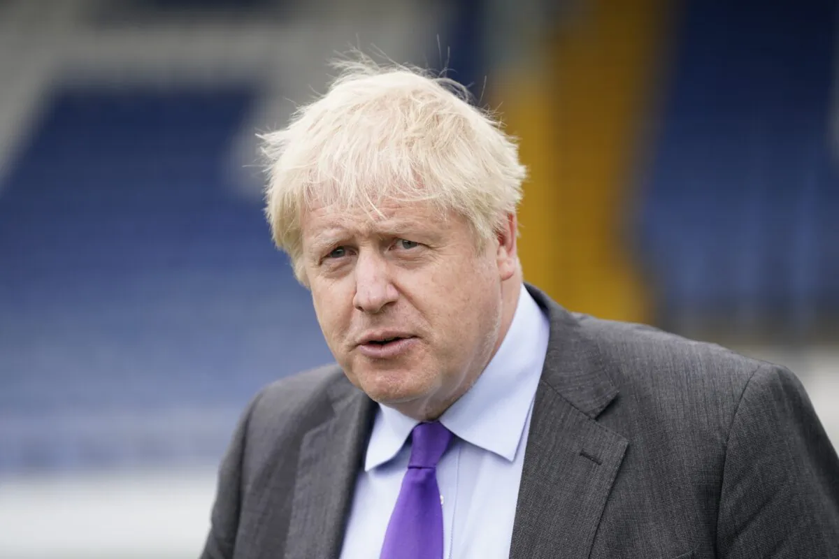 UK Prime Minister Boris Johnson during a visit to Bury FC at their Gigg Lane ground, in Bury, Greater Manchester, England, on April 25, 2002. (Danny Lawson - WPA Pool/Getty Images)
