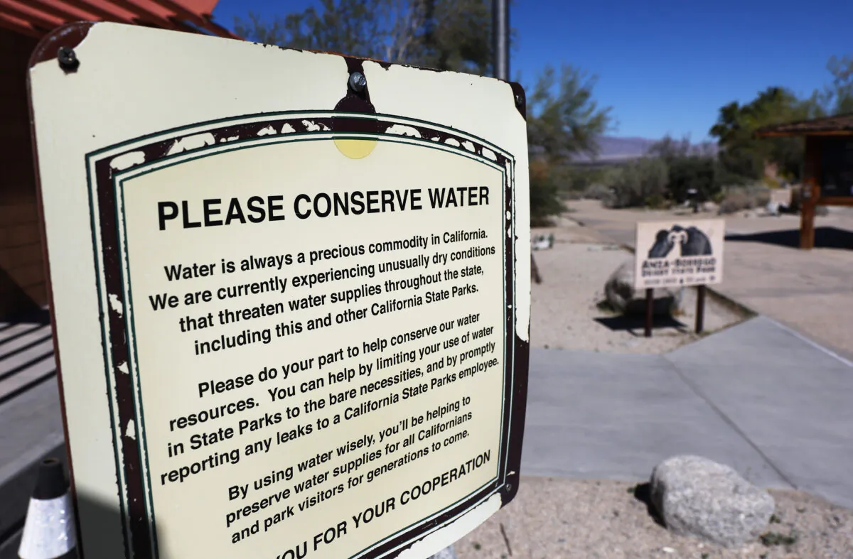 A sign reads "Please Conserve Water" at the visitor center at Anza-Borrego Desert State Park, near Borrego Springs, California, on March 23, 2022. (Mario Tama/Getty Images)
