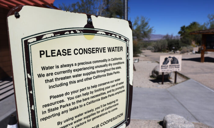 A sign reads "Please Conserve Water" at the visitor center at Anza-Borrego Desert State Park, near Borrego Springs, California, on March 23, 2022. (Mario Tama/Getty Images)