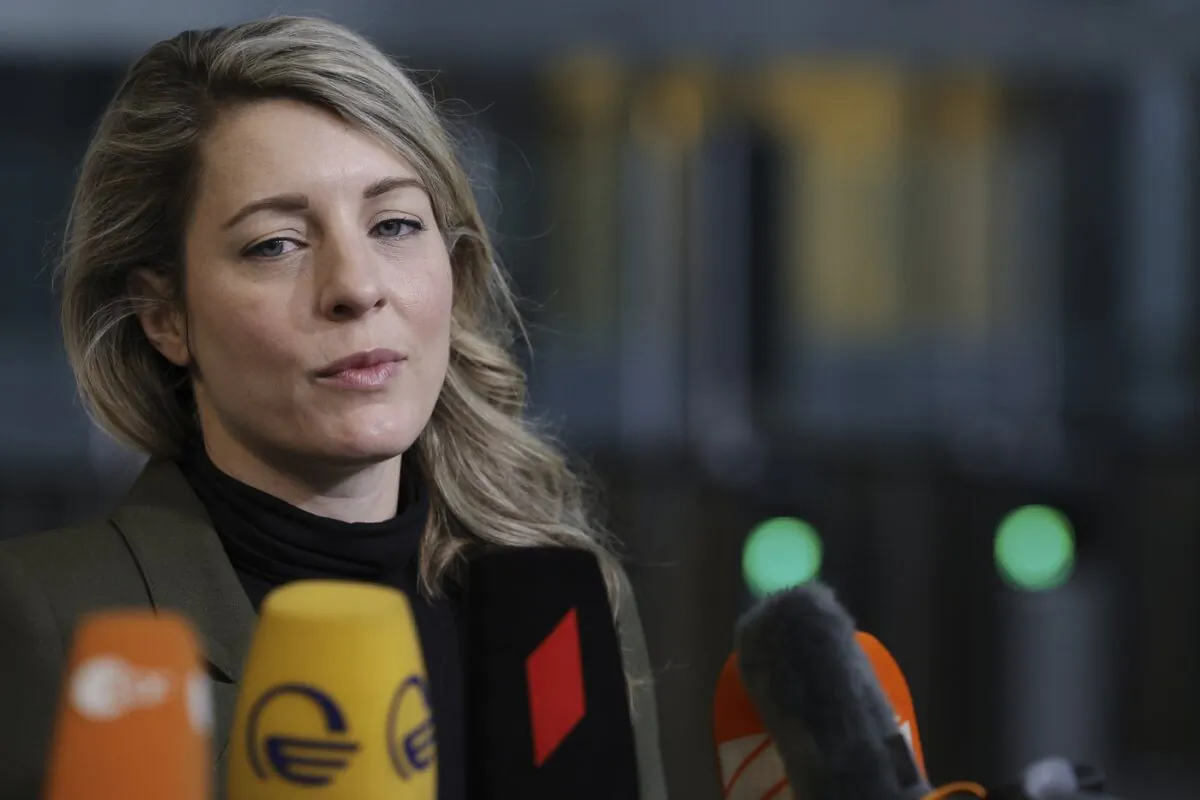 Canadian Foreign Minister Melanie Joly speaks with the media as she arrives for a meeting of NATO foreign ministers at NATO headquarters in Brussels, April 7, 2022. (The Canadian Press/AP-Olivier Matthys)