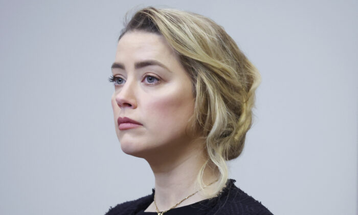 Actor Amber Heard arrives in the courtroom at the Fairfax County Circuit Court in Fairfax, Va., on April 28, 2022. (Michael Reynolds/Pool Photo via AP)