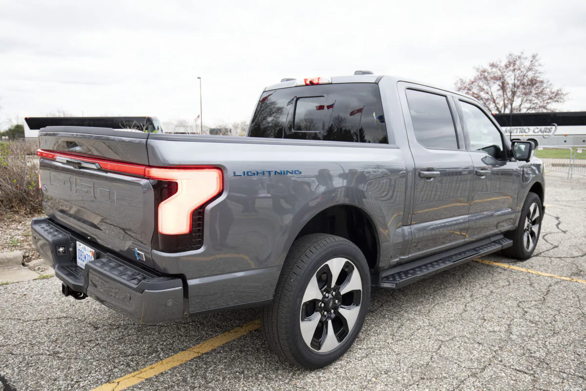 Members of the media are given ride and drives with the Ford F-150 Lightning pickup truck at the Ford World Headquarters, prior to the Lightning's official launch at the Rouge Electric Vehicle Center in Dearborn, Mich., on April 26, 2022. (Bill Pugliano/Getty Images)