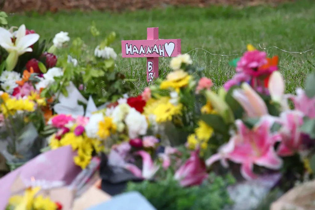 BRISBANE, AUSTRALIA - FEBRUARY 23: Flowers are seen during a vigil to remember murdered mother, Hannah Clarke and her three children at Bill Hewitt Reserve in Camp Hill on February 23, 2020 in Brisbane, Australia.  Hannah Clarke, and her children Aaliyah, 6, Laianah, 4, and Trey, 3, were killed by Rowan Baxter after he doused them in petrol and set their car alight. Baxter stabbed himself and died shortly after. (Photo by Jono Searle/Getty Images)