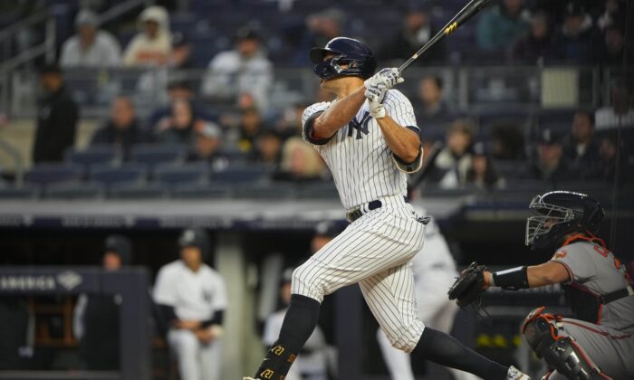 New York Yankees right fielder Giancarlo Stanton (C) hits a two-run home run against the Baltimore Orioles during the first inning at Yankee Stadium in New York, on Apr 27, 2022. (Gregory Fisher/USA TODAY Sports via Field Level Media)