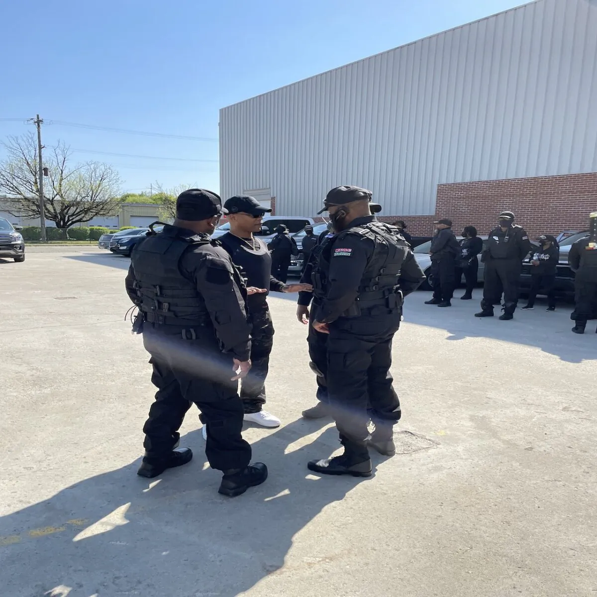 NFAC group leader John Johnson talks to his colleagues on April 27 outside the Louisville Central Community Center. (Ken Silva/The Epoch Times)