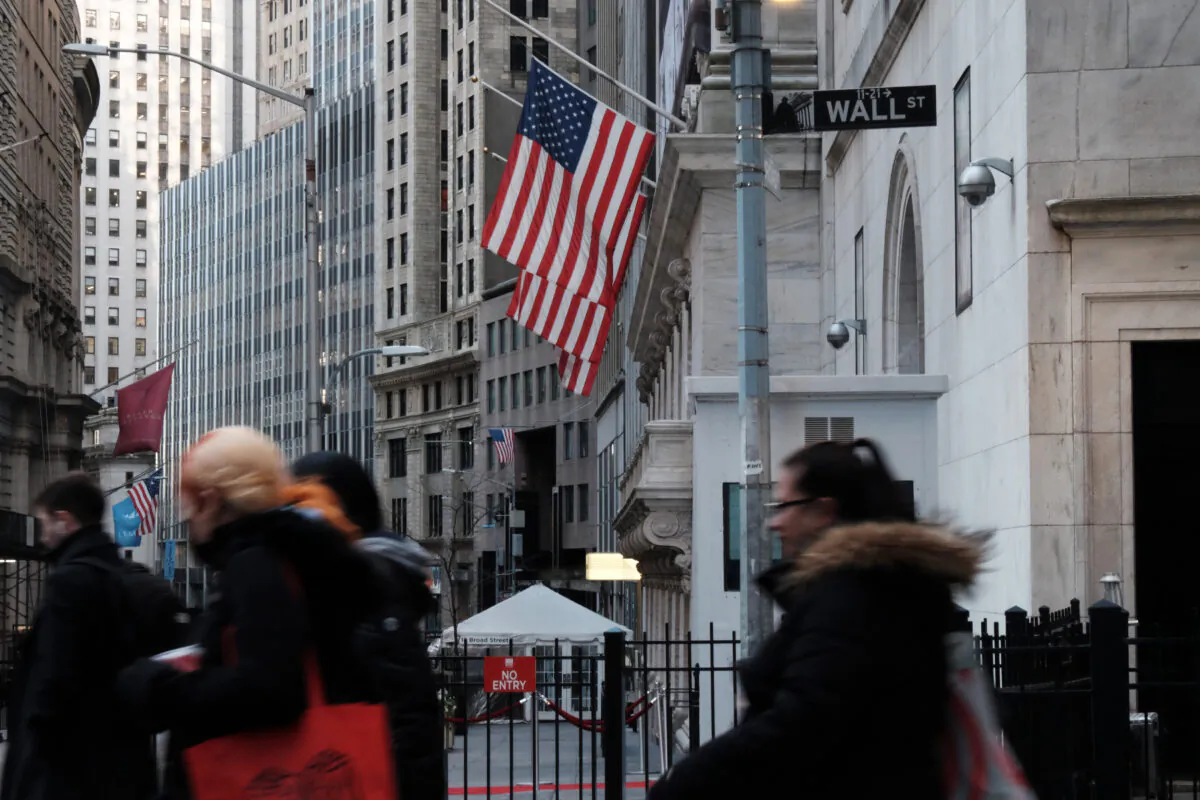 People walk by the New York Stock Exchange (NYSE) in the New York's Financial District, on Jan. 26, 2022. (Spencer Platt/Getty Images)