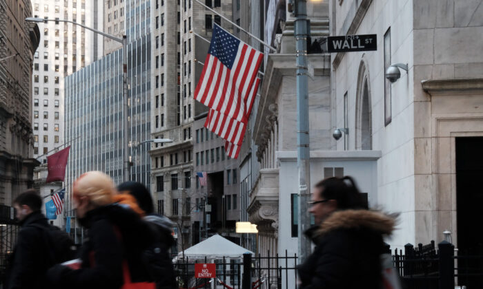 People walk by the New York Stock Exchange (NYSE) in the New York's Financial District, on Jan. 26, 2022. (Spencer Platt/Getty Images)