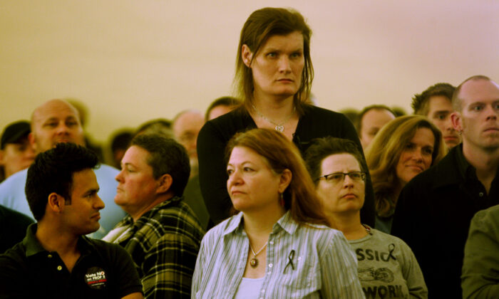 In this file photo, members of the community listen to speakers during a rally at the San Diego Lesbian Gay Bisexual Transgender Community Center in San Diego on November 5, 2008. (Sandy Huffaker/Getty Images)