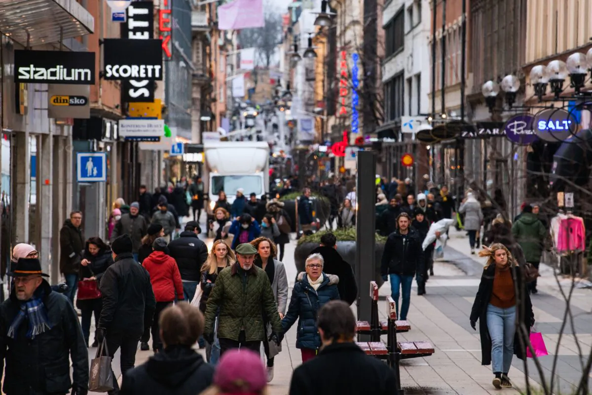People visit one of Stockholm, Sweden's busiest shopping streets during the ongoing COVID-19 pandemic, on Feb. 4, 2022. (Jonathan Nackstrand/AFP via Getty Images)