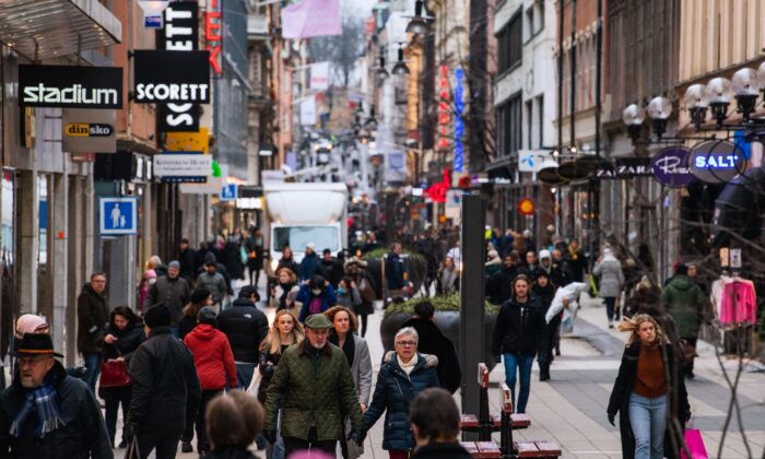 People visit one of Stockholm's busiest shopping streets during the ongoing COVID-19 pandemic, on Feb. 4, 2022. (Jonathan Nackstrand/AFP via Getty Images)