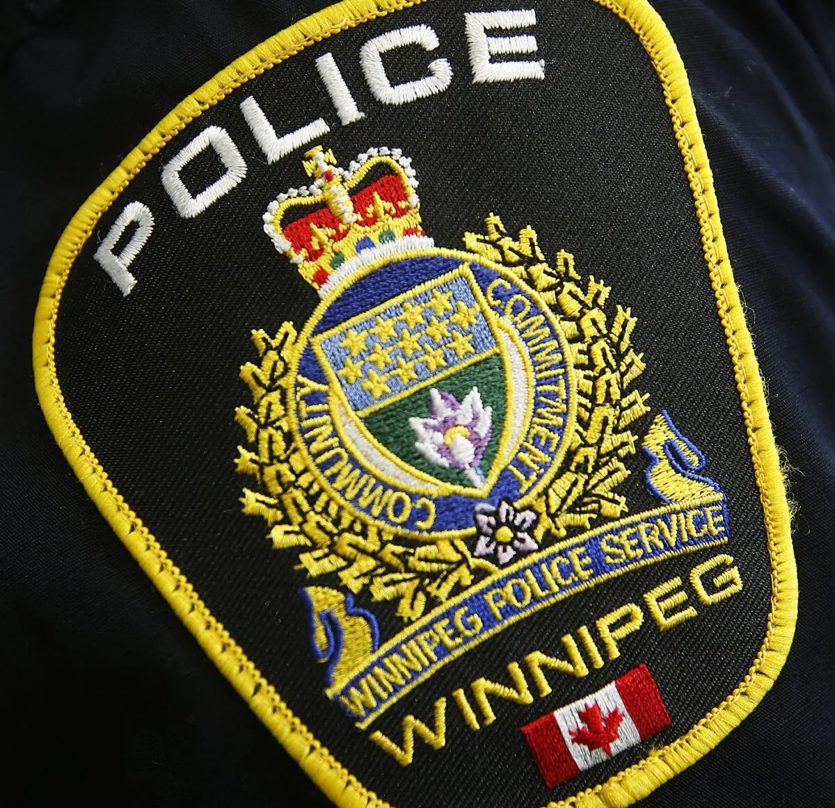 Photo of a Winnipeg Police Service shoulder badge on an officer on Nov. 5, 2019. (The Canadian Press/John Woods)