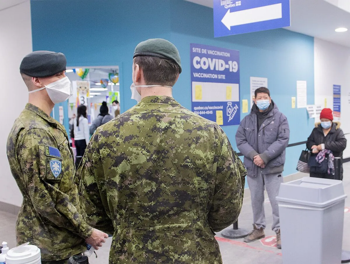 Members of the Canadian Armed Forces are shown at a COVID-19 vaccination site in Montreal, Jan. 16, 2022, as the COVID-19 pandemic continues in Canada. (The Canadian Press/Graham Hughes)
