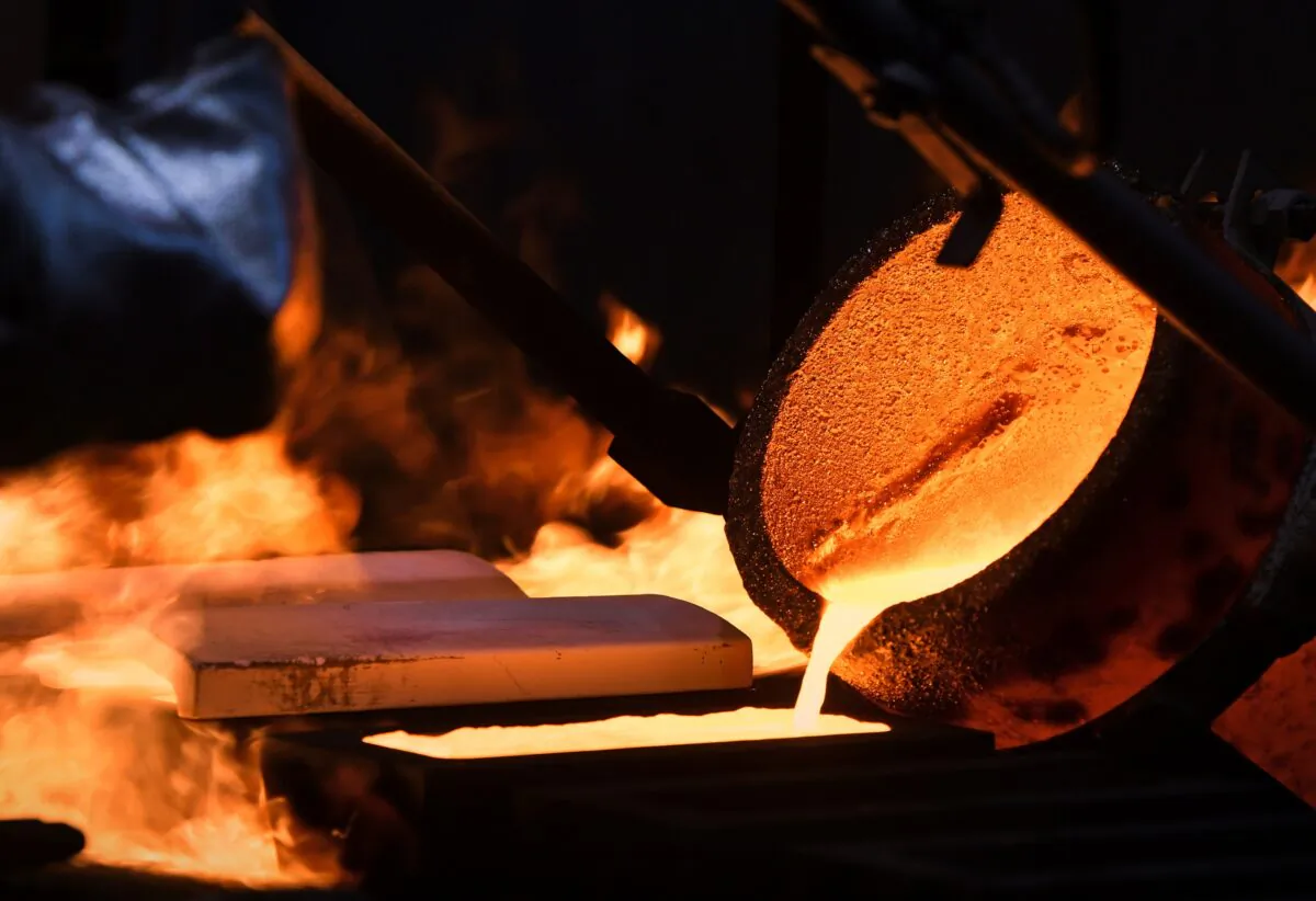 An ingot of 99.99 percent pure gold is cast at the Krastsvetmet non-ferrous metals plant in the Siberian city of Krasnoyarsk, Russia, on March 10, 2022. (Alexander Manzyuk/Reuters)