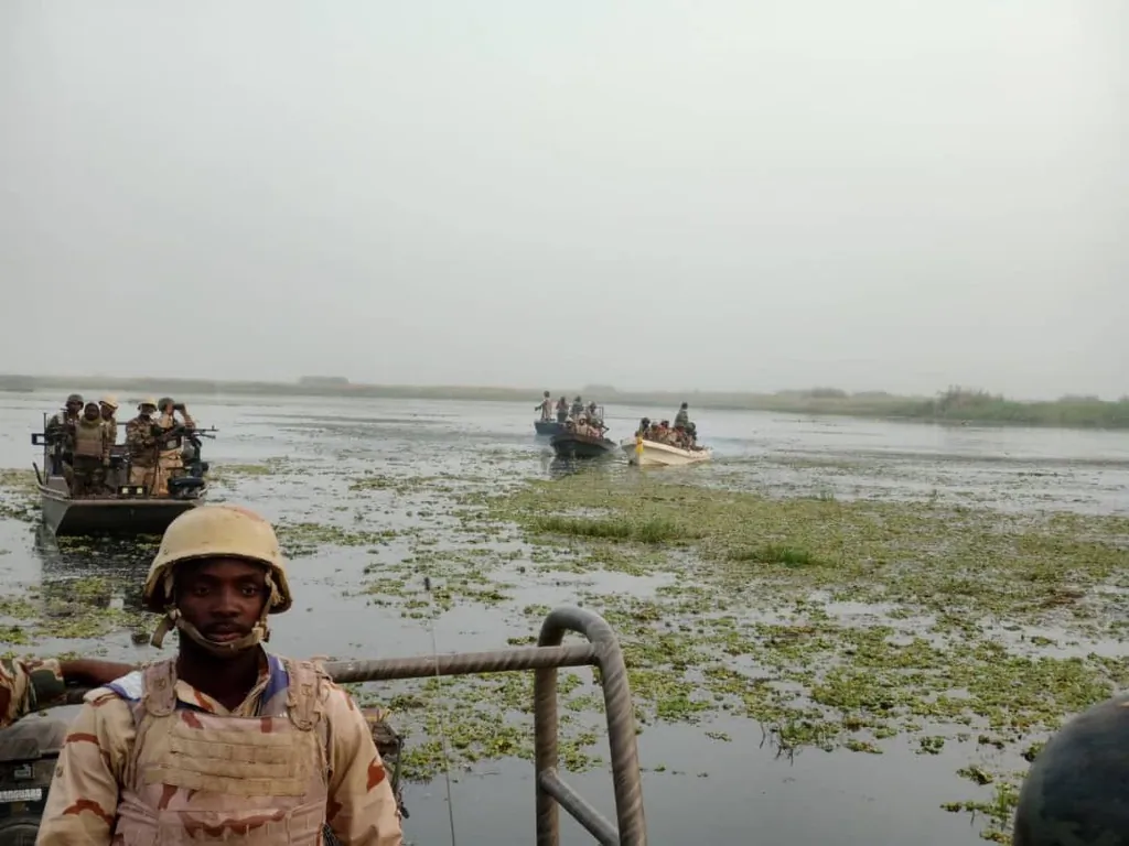 Soldiers with a multinational force transport troops to clear Boko Haram enclaves on Lake Chad in April 2022. (Courtesy of Col. Muhammad Dole)