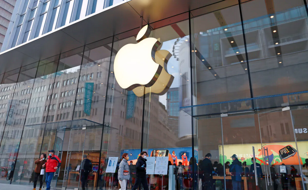 Customers shop at apple's flagship store on Nanjing Road pedestrian street in Shanghai, China, Feb. 23, 2022. (Costfoto/Future Publishing via Getty Images)