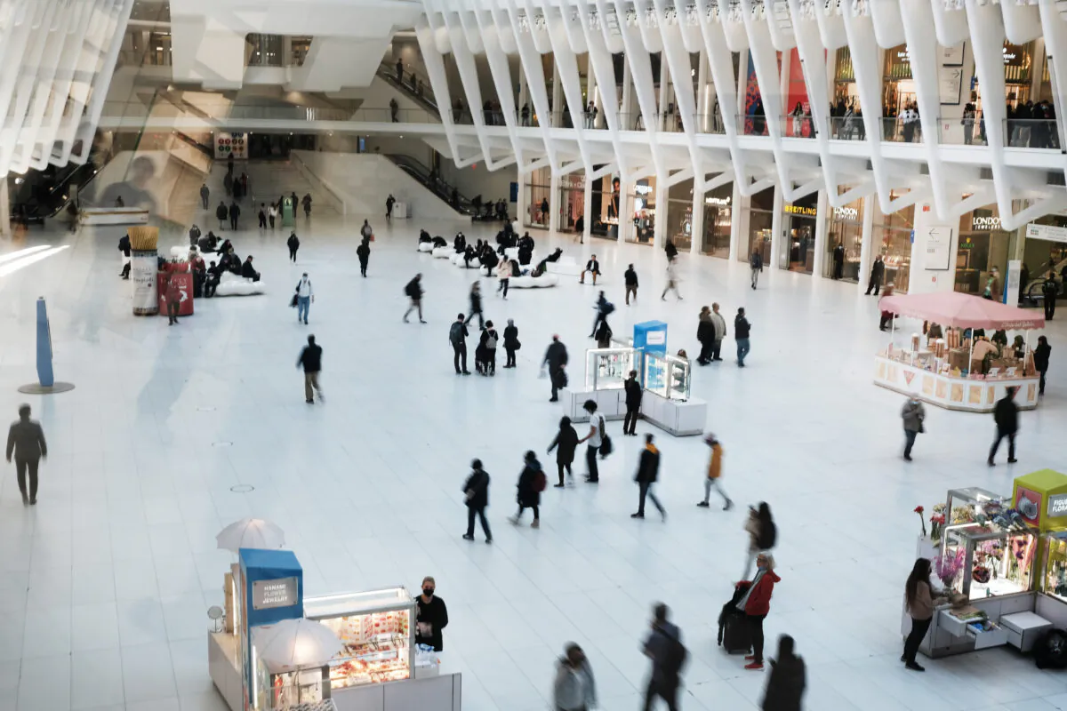 People walk through a mall in Manhattan, New York, on April 4, 2022. A recent report from the Commerce Department shows a 1.4 percent drop in the U.S. GDP for the first quarter of the year. (Spencer Platt/Getty Images)