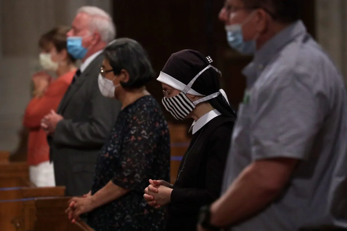 People participate in mass at a church in Washington on June 22, 2020. (Alex Wong/Getty Images)