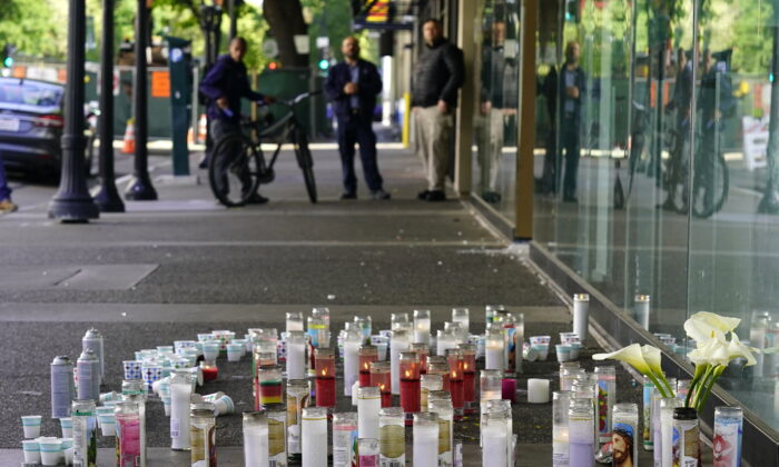 Candles and flowers at a memorial for those killed and injured in a mass shooting on April 3, 2022, in Sacramento, Calif., on April 5,2022. (Rich Pedroncelli/AP Photo)