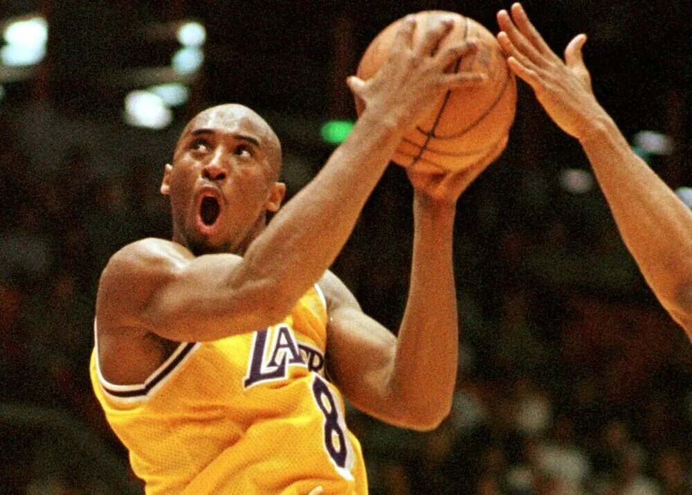 Los Angeles Lakers' Kobe Bryant (8) of the goes in shot against the Utah Jazz during the second half of NBA playoff basketball game in Inglewood, Calif., on May 8, 1997. (Chris Pizzello/AP Photo)